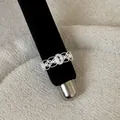 Close-up detail of a silver French lace hollow ring featuring sparkling crystal stones. - Oval Gemstone Hollow Style (Style 12 Ring)