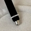 Close-up of delicate silver lace filigree ring with pearls on black display mandrel. - Artificial Pearl Lace Style (Style 17 Ring)