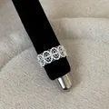Detailed close-up showing the intricate lace pattern of the silver hollow-out ring - Continuous Lace Hollow Style (Style 19 Ring)