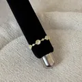 Detailed macro view of a gold lace openwork ring with round cat-eye cabochon stones - Cat's Eye Hollow Braided Style (Style 20 Ring)