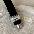 Close-up detail of a silver-toned French lace cutout ring with square zirconia stones. - French Lace Hollow Square Rhinestone Style (Style 31 Ring)