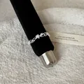 Detailed close-up showing the intricate lace hollow design of this silver metal ring. - Braided Texture Lace Style (Style 9 Ring)