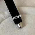 Detailed view of a vintage lace hollow metal ring on a black velvet display stand. - Diamond Lattice Lace Hollow Style (Style 24 Ring) / Silver
