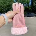 Detail view of pink suede winter glove featuring soft faux fur cuff and brand label - Single Vertical Line / Pink