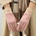 Close-up of pink thermal touch-screen gloves with beige ribbed cuffs on a model - Touchscreen Ribbed Style / Pink