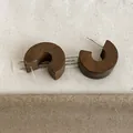 Detailed view of vintage wooden C-hoop stud earrings with natural brown texture - C-Hoop Studs / Brown