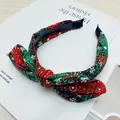Christmas bow headband featuring a festive red and green plaid with snowflake pattern. - Bow Hairband / Green