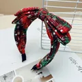 Red and green plaid Christmas bow headband with white snowflake pattern decoration - Green