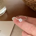Delicate silver twisted band ring featuring a sweet white pearl flower centerpiece - Pearl Flower Style (U5-51) / Silver