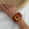 Detailed macro view of a retro terracotta resin cuff bracelet with amber square stone - Brick Red Resin Square (3193)
