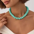 Bohemian style turquoise marbled resin bead necklace with gold spacers worn by model - Mint Green Necklace (7957)