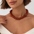 Bohemian style necklace featuring reddish-brown resin beads with gold stainless steel - Orange Red Necklace (7957)