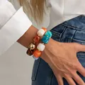 Elegante bracciale elastico vintage in perle di resina colorate con accento dorato - Oro + Colori Misti