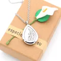 Macro view of a 28mm stainless steel teardrop essential oil aromatherapy necklace - Pendant + 10 Cotton Pads + Necklace / HS002 (Feather)