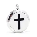Close-up of stainless steel aromatherapy locket with hollowed-out cross design - Steel Color (ai-0)