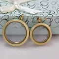 Detailed view of two gold-plated magnetic glass floating charm lockets with frosted finish - 30mm / Gold
