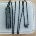 Black stainless steel cylindrical perfume diffuser necklace with hollow floral design - Black Pendant + Cotton Core + Necklace / Black