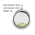 Detail van het 30 mm ronde roestvrijstalen glazen medaillon met groene edelstenen - 30mm / Staalkleur