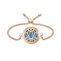 Close-up of rose gold aromatherapy bracelet with lotus locket and blue felt pad. - Lotus / 25mm Rose Gold (10 Cotton Pads)