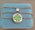 Close-up of rose gold tree of life aromatherapy bracelet on a light blue velvet gift box - Flowering Tree / 25mm Rose Gold (10 Cotton Pads)