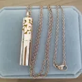 Gold stainless steel aromatherapy locket necklace displayed on a blue velvet box - Rose Gold Pendant + Pad + Necklace / Rose Gold
