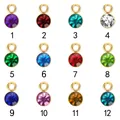 Detalle de 12 dijes coloridos de 6mm con piedras de nacimiento y monturas de acero dorado - 1 / Dorado