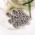 Silver metal positioning beads with white rubber core for slider charm bracelets. - Steel