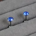 Pair of round blue birthstone stud earrings made of titanium steel in a velvet tray - 5mm / Sapphire Blue (September)