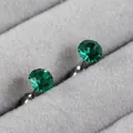 Minimalist titanium steel stud earrings featuring emerald green round cut birthstones - 5mm / Emerald (May)