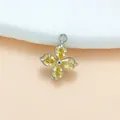 Silberfarbener Kleeblatt-Anhänger aus Titanstahl mit vier gelben Zirkonia-Steinen im Birnenschliff. - Steel color gold zirconium