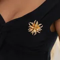 Creative gold firework flame alloy brooch pin for women elegantly shown on black clothing - Gold-00409 Brooch