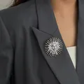 Creative silver sun goddess relief brooch pinned elegantly on a professional grey suit lapel - Sun Goddess Relief (0410) / White K/Silver