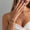 Elegante pulsera de dedo de varias capas en oro con cruz y detalle cadena serpiente - Pulsera con Anillo (7086) / Dorado