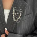 Stylish silver and gold tassel brooch with heart and star charms on a pinstripe blazer - Rhinestone Star Heart Style (0317) / Multicolor