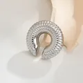 Ribbed C-shaped stainless steel ear cuff in silver with lava texture. - Steel (Threaded)