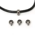 Detailed view of gunmetal grey plastic CCB bail beads for jewelry and DIY crafts - Flattened Round / 9x12mm (50 Pieces/Pack) / Gunmetal