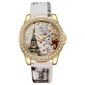 Detalle de reloj de cuarzo dorado con estampado de la Torre Eiffel y bisel strass - Blanco