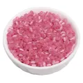 Small pink round glass cat-eye seed beads for DIY jewelry making in a white bowl - Dark Red