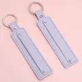 Pair of purple faux leather strap keychains with silver rings and rivets on pink surface. - 15cm 1 Piece/Pack / Light Purple