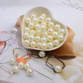 Round iridescent white ABS pearl beads in a heart-shaped bowl for DIY jewelry projects - 6mm (Approx 100pcs/Pack) / Off White