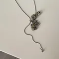 Long silver necklace featuring natural Dalmatian stone pendants and grape cluster beads. - Dalmatian Jasper