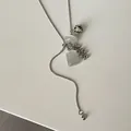 Detailed view of silver serpentine lariat necklace with dalmatian stone and bead cluster - White