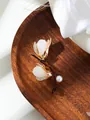 Detailed view of an elegant magnolia flower brooch with pearls and crystals. - Gold Style (A23-198) / Gold