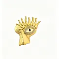 Detailed macro view of a surrealist golden evil eye brooch featuring sparkling rhinestones - Portrait Silhouette Evil Eye Style (Y3)