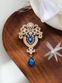 Detail of a vintage palace-style brooch with blue crystal teardrops and rhinestones - Dark Blue Crystal Style (A17-34)