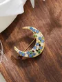 Detailed view of an exquisite gold crescent moon brooch with blue and clear rhinestones. - Crescent Moon Blue Rhinestone (A23-158)