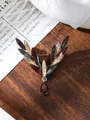 Detail view of luxury vintage leaf brooch with colorful crystals on wooden surface - Retro Mixed Color (A9-44)