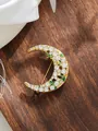 Detailed view of the sparkling moon-shaped brooch with inlaid white rhinestones - Crescent Moon White Rhinestone (A23-156)