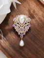 Detailed close-up of a vintage violet rhinestone brooch with elegant waterdrop pearls - Violet Style (A23-175)