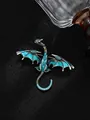 Detailed view of vintage dragon brooch with blue enamel and crystal accents. - Lake Blue